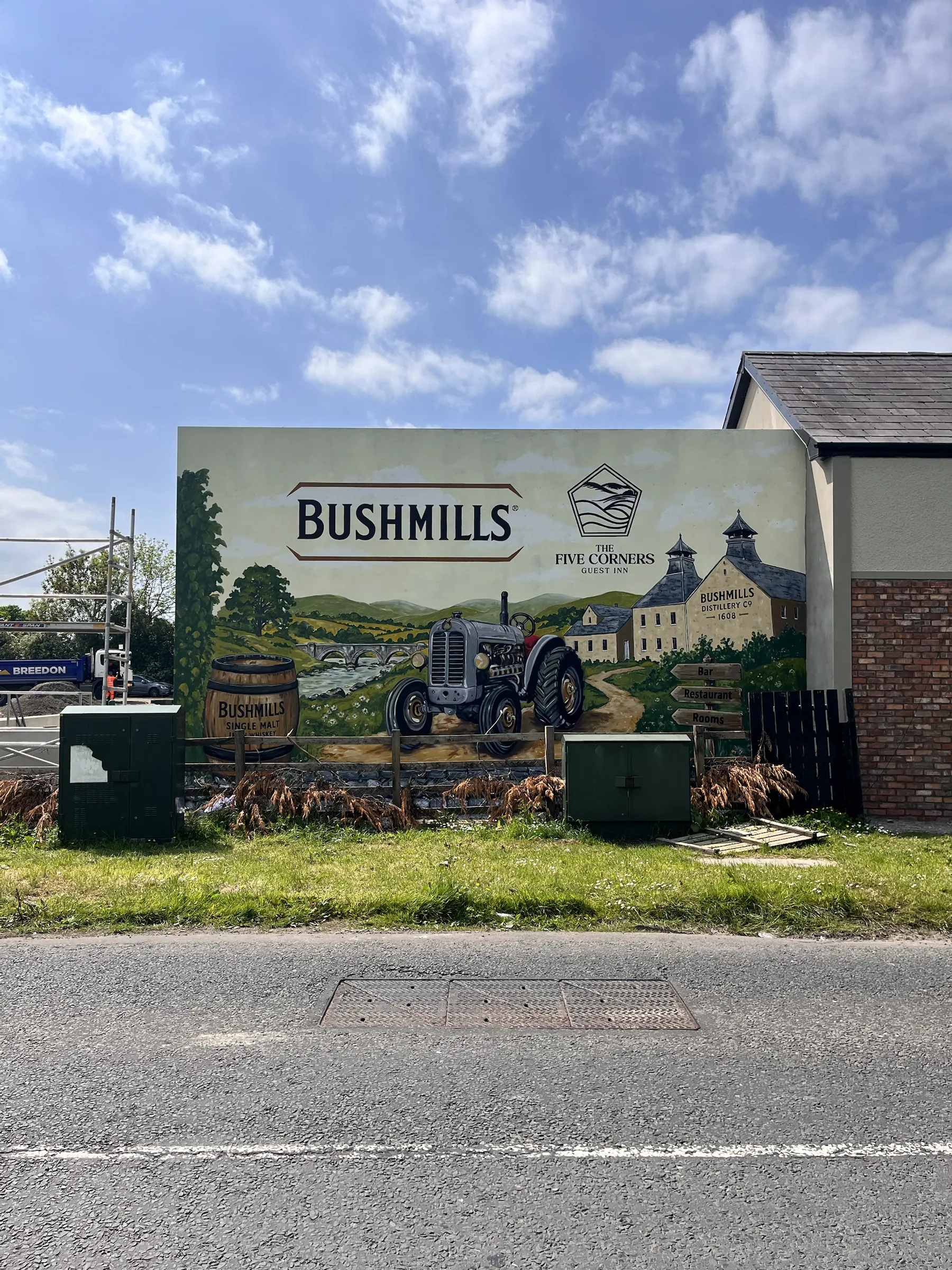 The finished Bushmills mural on The Five Corners Inn’s gable, seen from across the road.